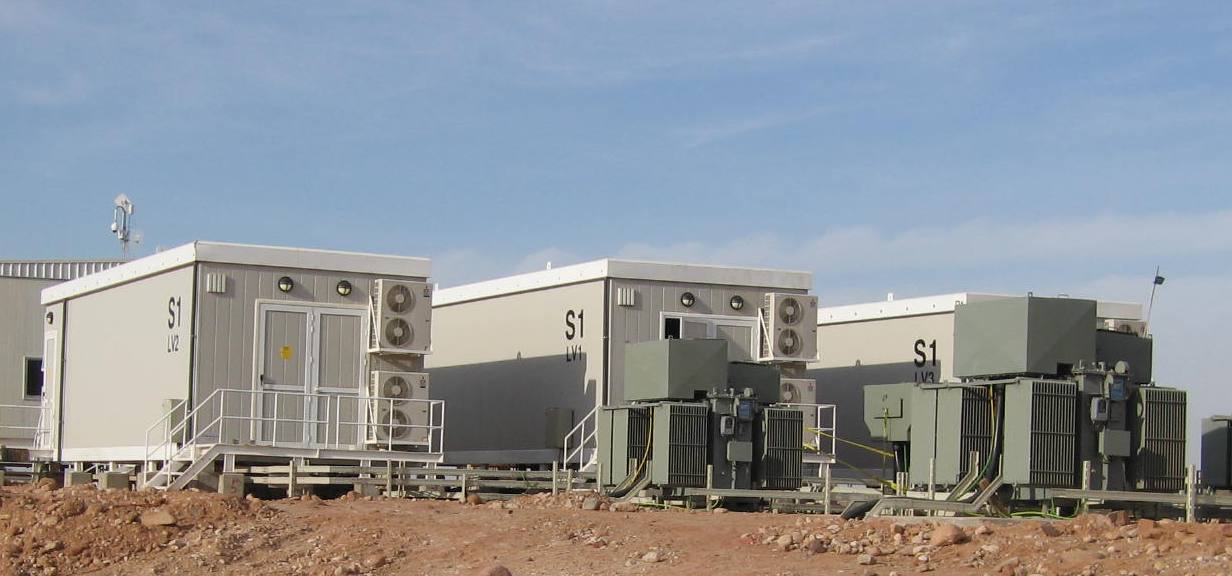 Installed Arab Potash electrocentres with transformers and access stairs in Jordan’s Dead Sea region